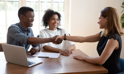 A couple talking with a mortgage loan officer