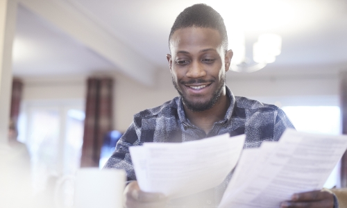 A person looking over paperwork