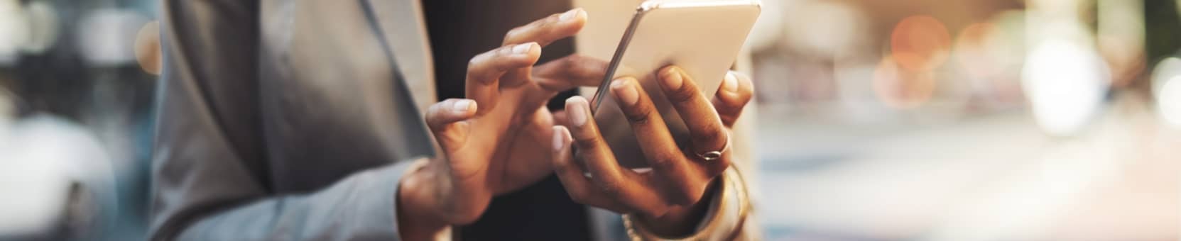 A person using their device for online and mobile banking