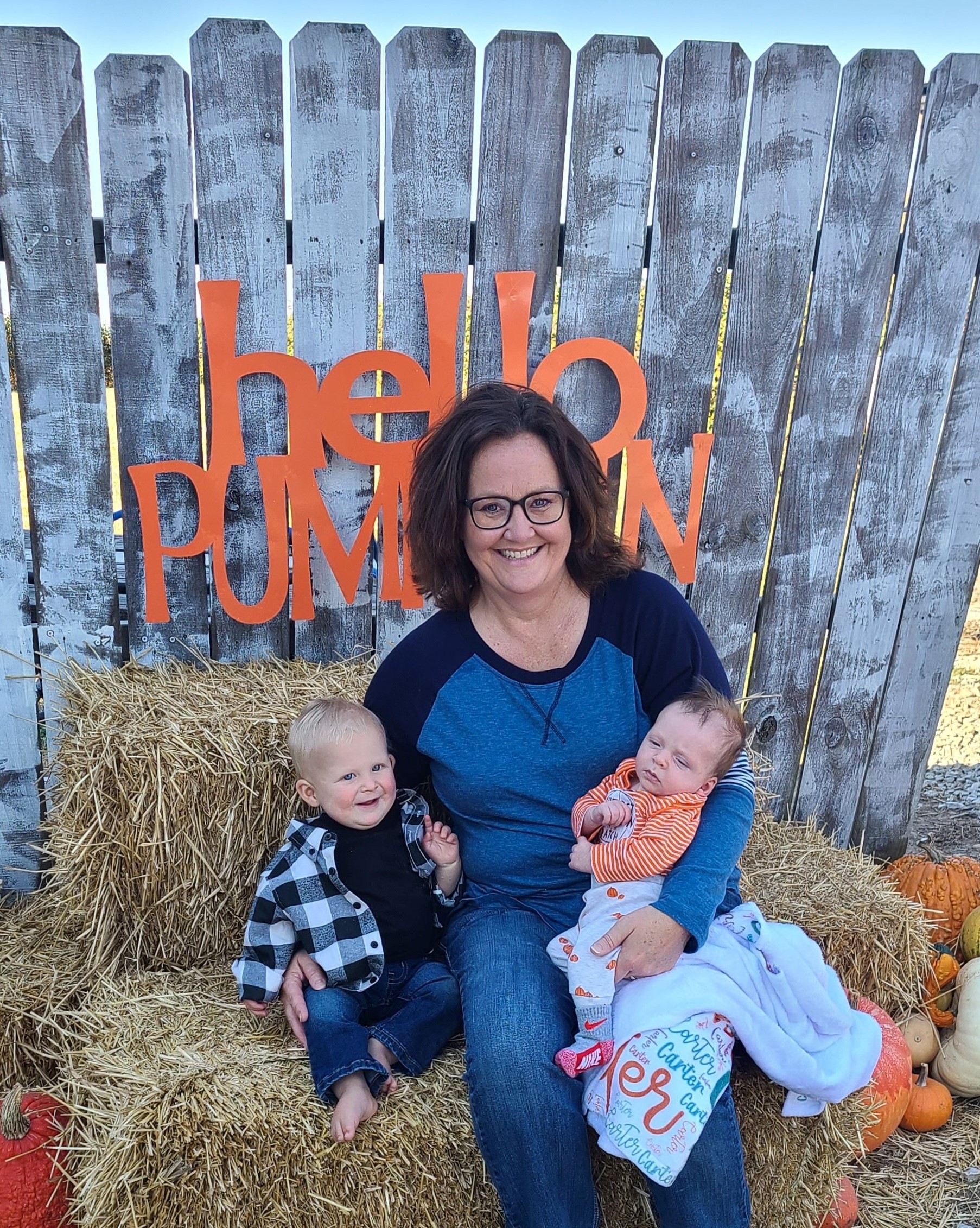 Cathy holding two babies