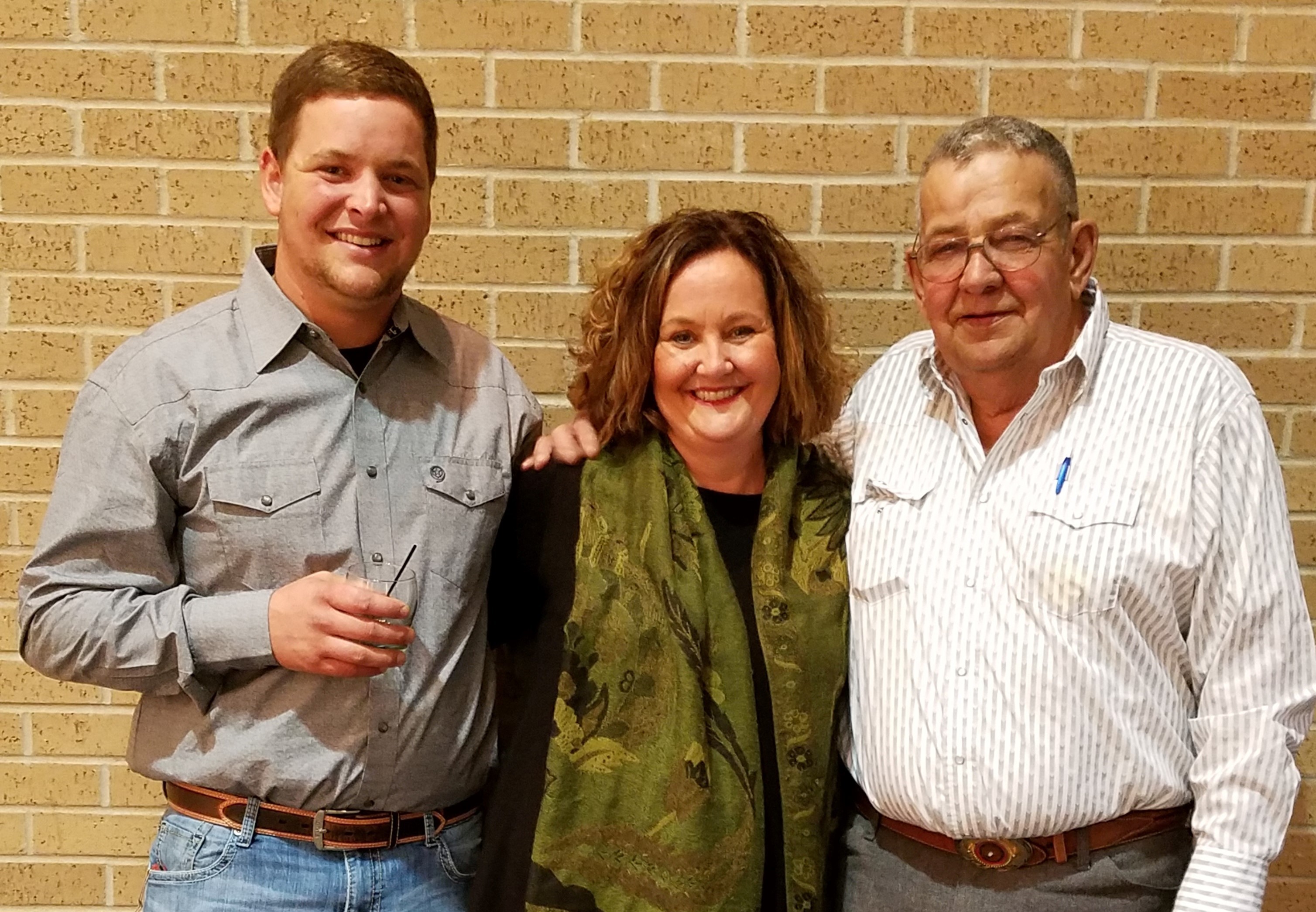 Cathy standing with her family