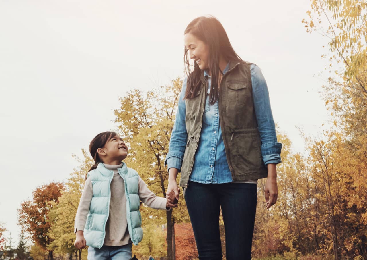 Woman walking with her daughter